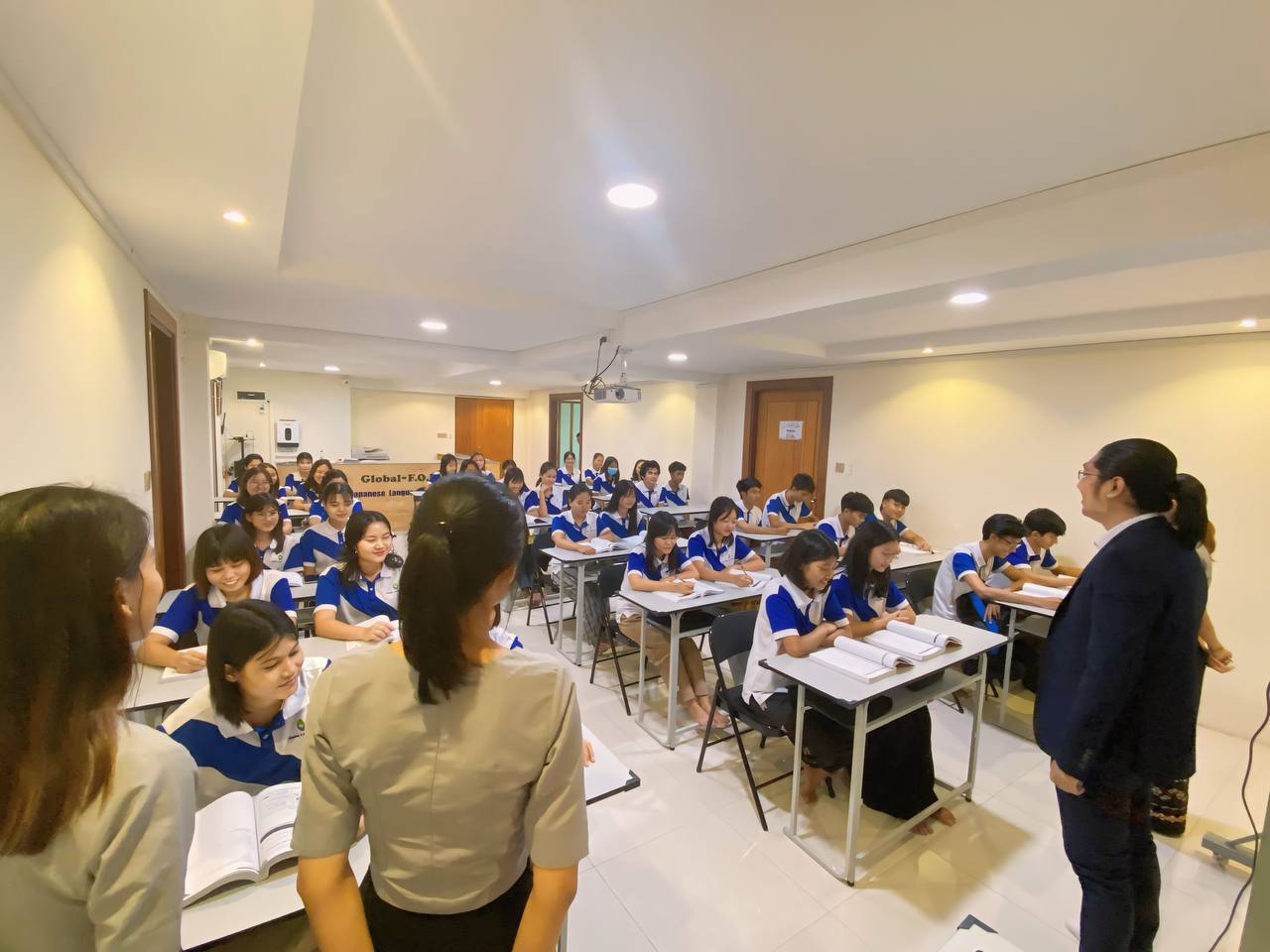 A teacher presenting to a Global F.O.R classroom