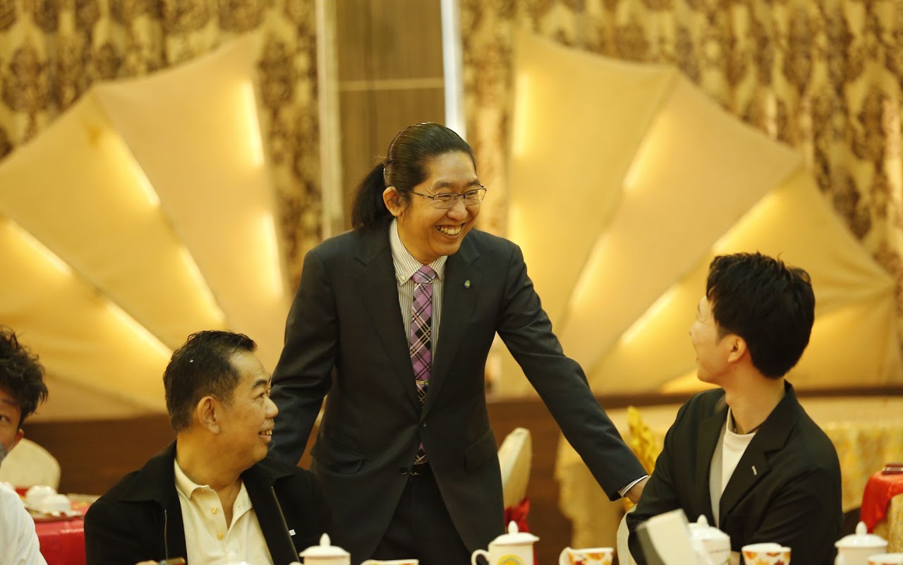 Global F.O.R representative at a business gathering