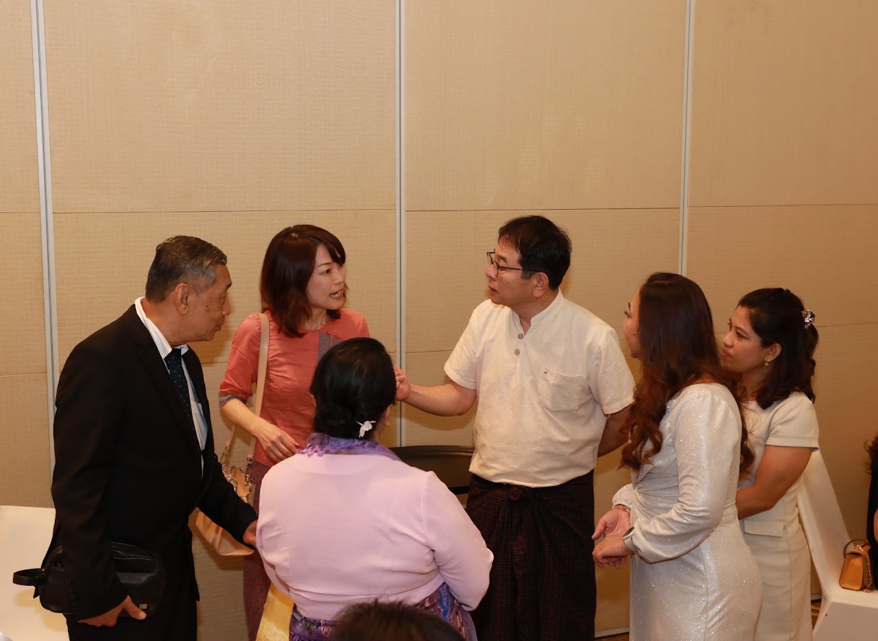 Global F.O.R representatives in conversation at a company event